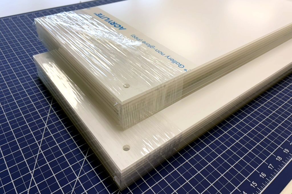 Acrylite P99 non-glare acrylic cut, drilled, and shrink-wrapped