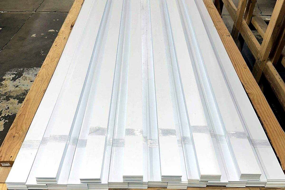 White styrene sheet ripped to width and banded on a pallet