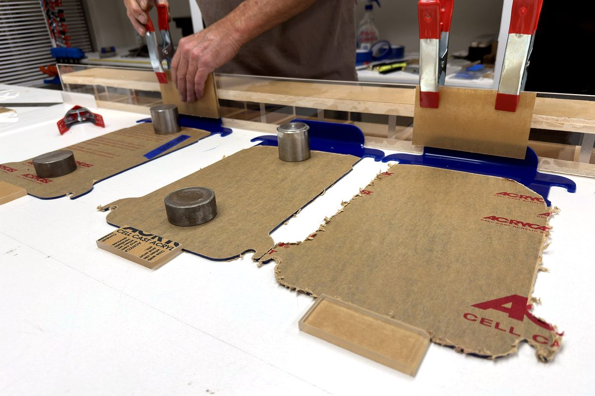 Forming and assembling laser-cut acrylic parts with clamps and weights