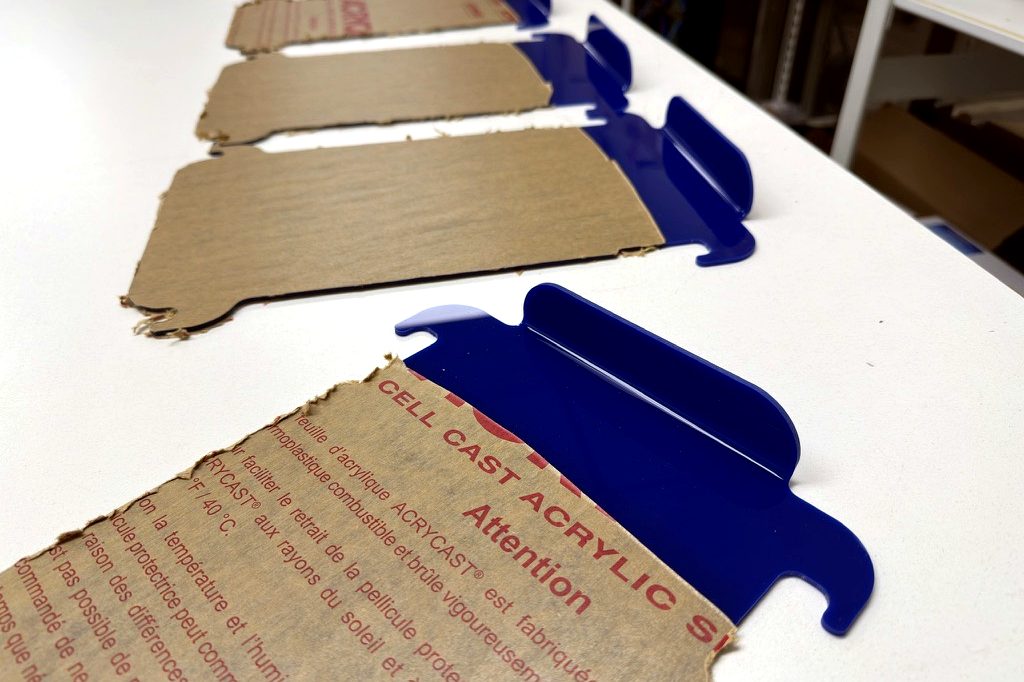 Line-bent blue acrylic parts with crisp edges