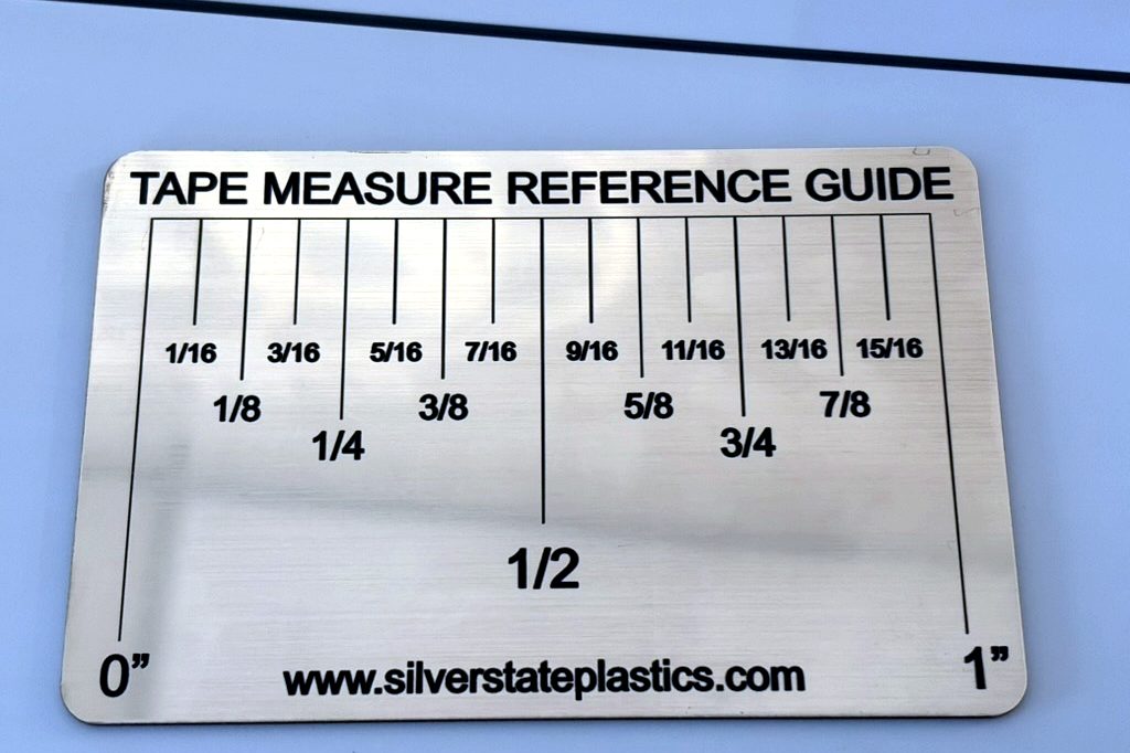 Laser-engraved tape measure reference guide in brass-look engraving stock