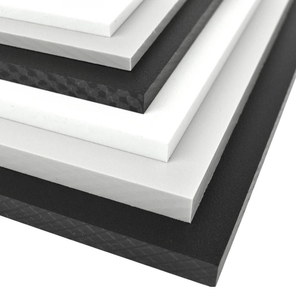 Stack of black and white plastic sheets