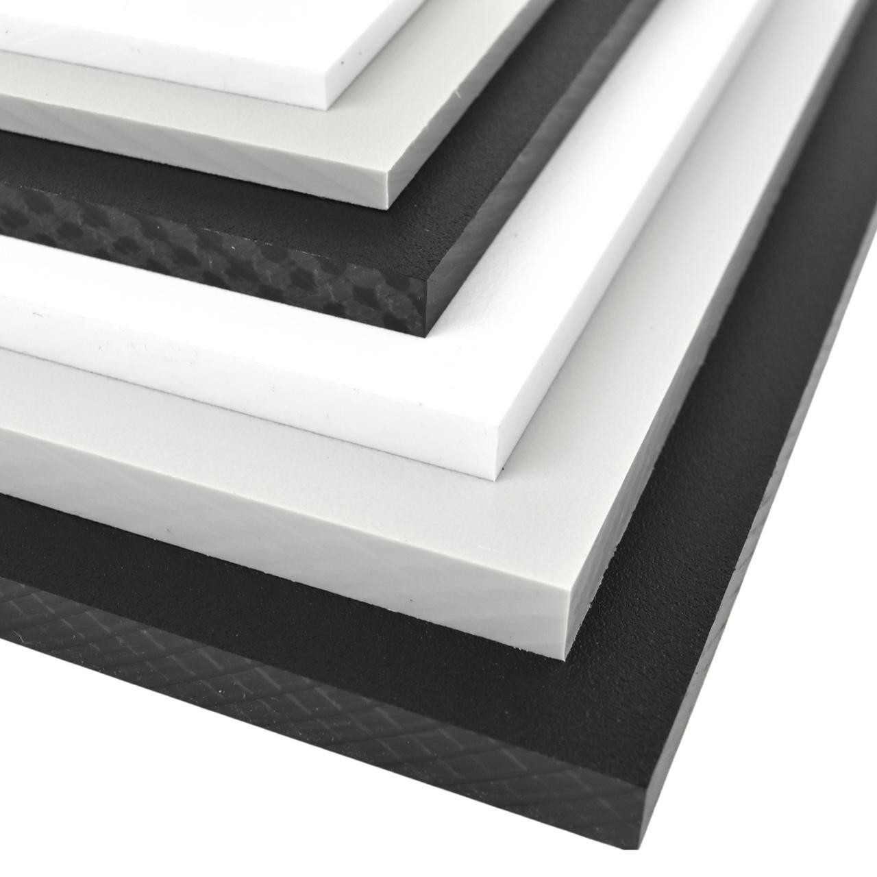 Stack of black and white plastic sheets