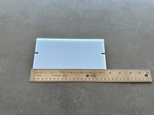 Ruler next to white plastic divider